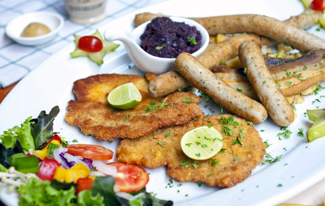 Traditional Wiener Schnitzel and the spicy currywurst