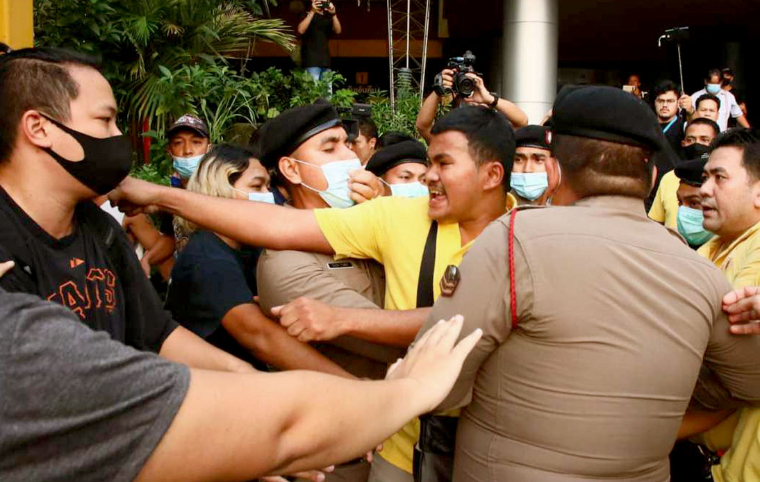 A group of yellow-clad people and student protesters had a brief fight